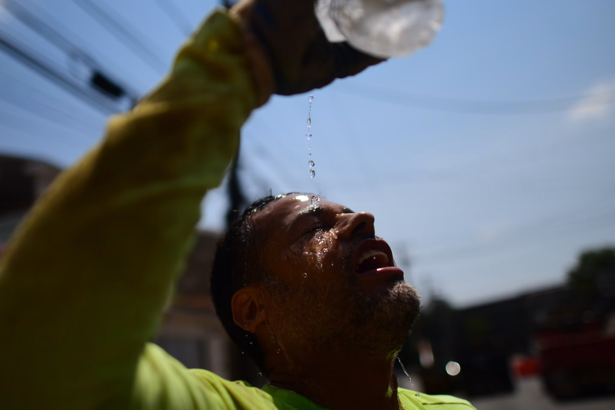 Agricultural worker hydrating in field