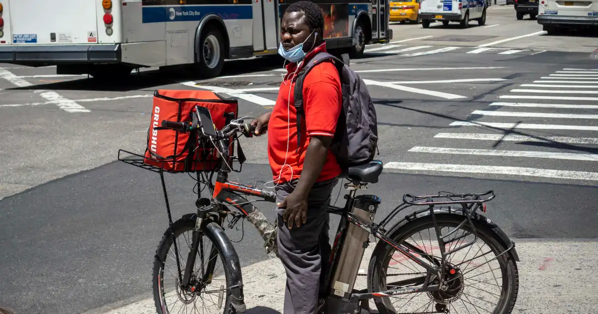 Delivery rider under sun