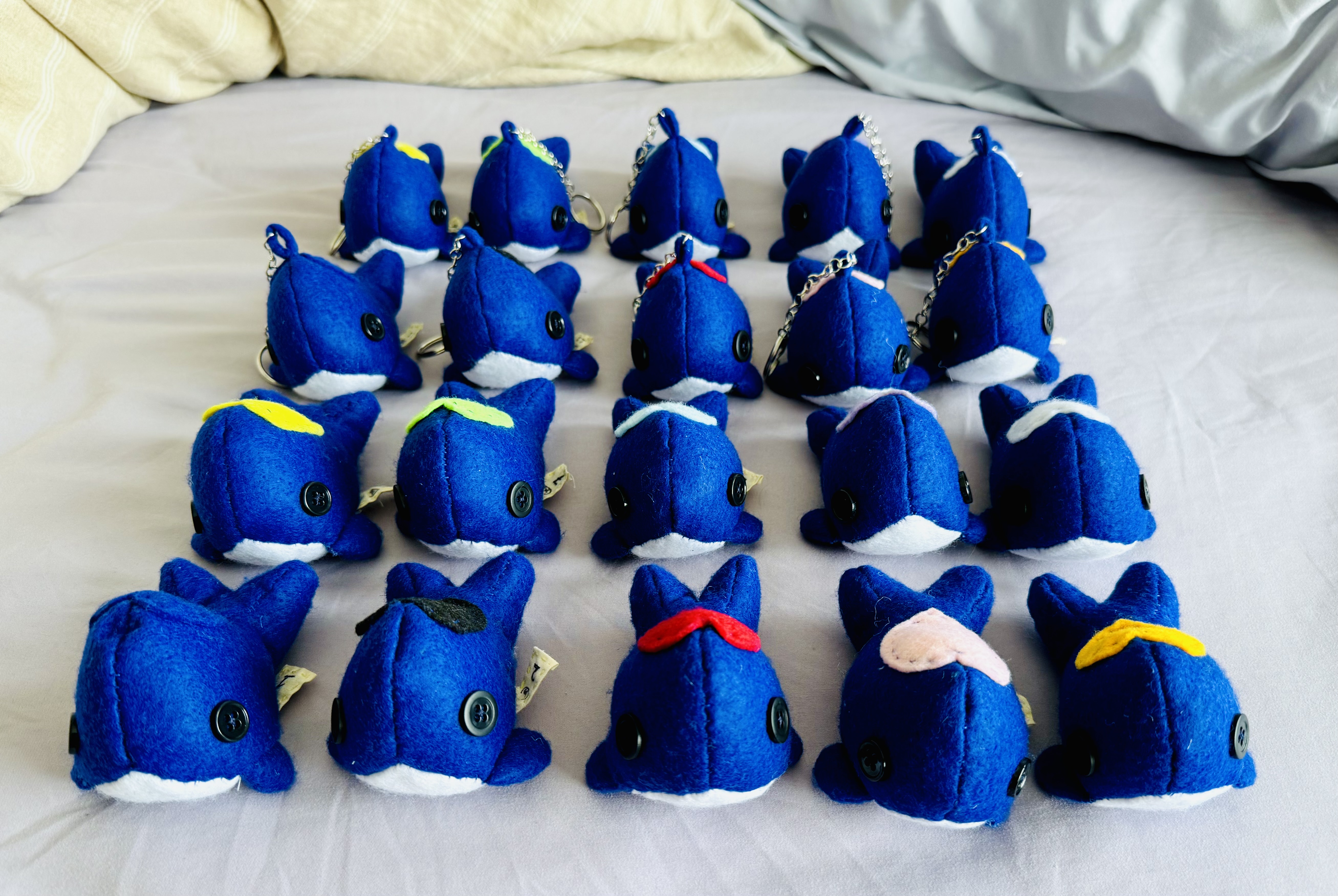 20 laid out whales of the different colors