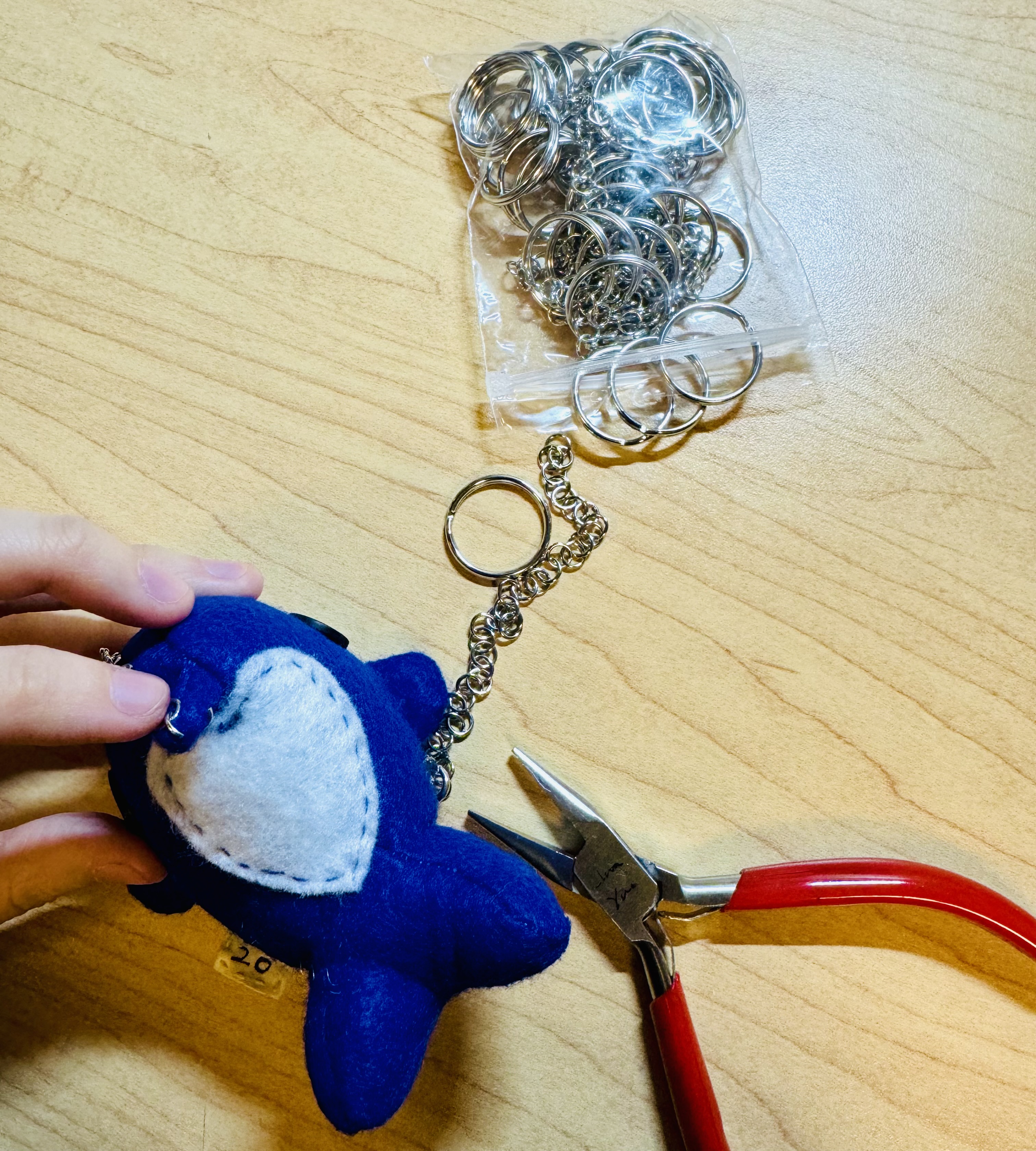 Attaching a keychain onto a whale
