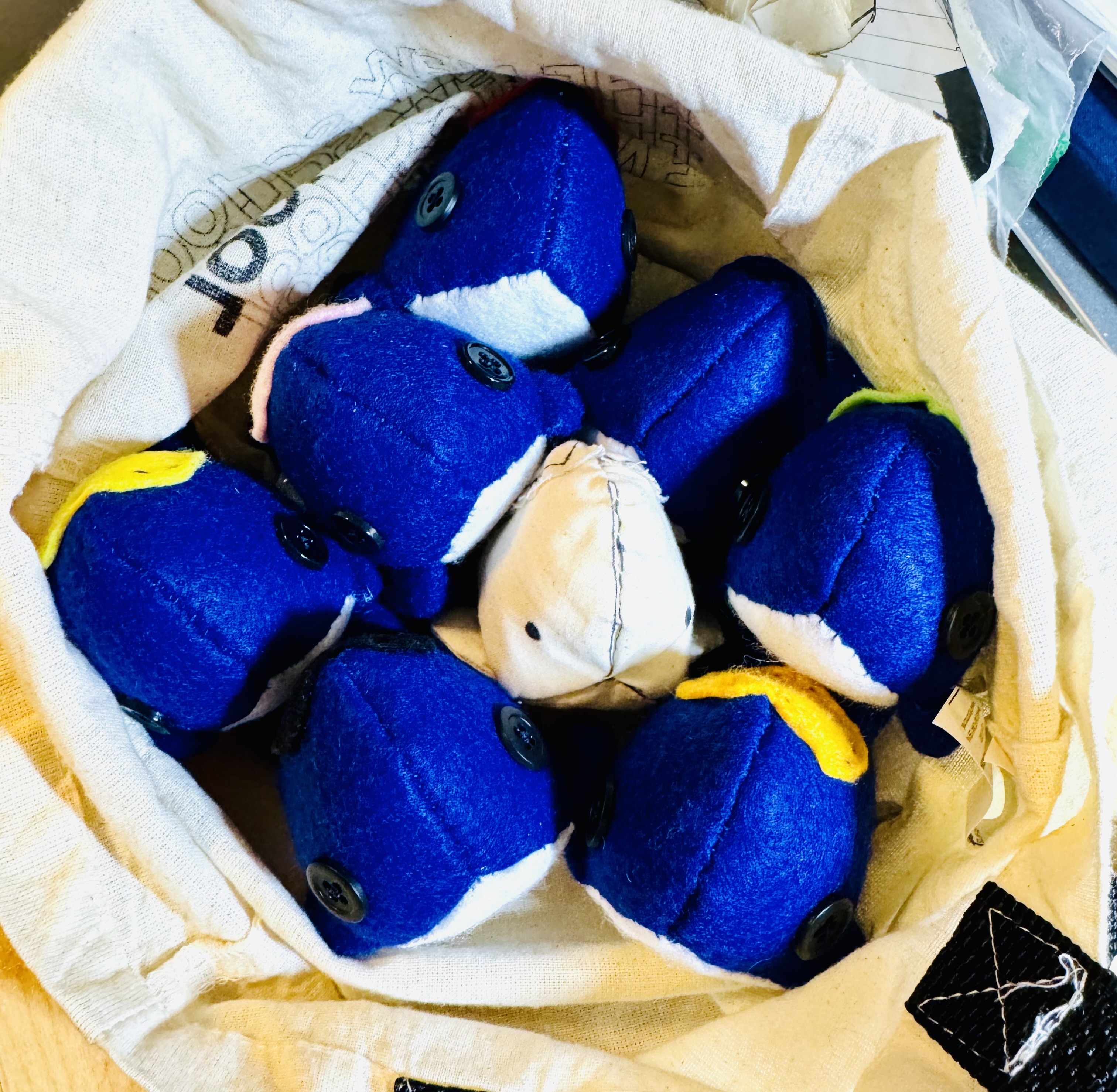 A bag of whales including a prototype one in the middle of the group