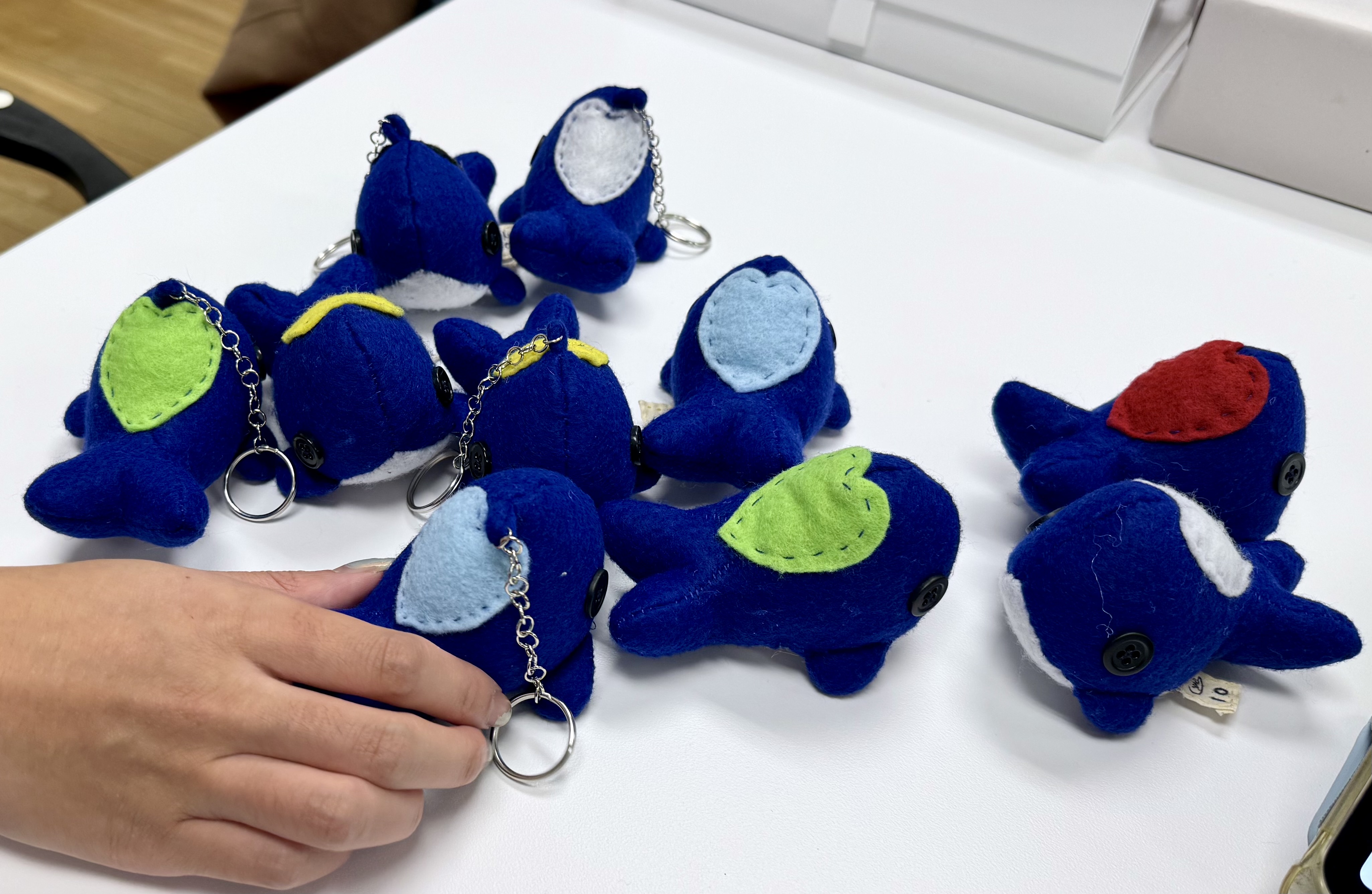 Handing out whales to classmates at the end of the Fall 2023 semester